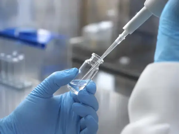 Gently reconstituting a research peptide vial